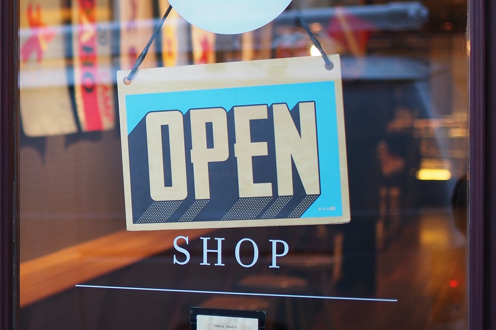 starting your business - 10 things to do - open shop sign in front window