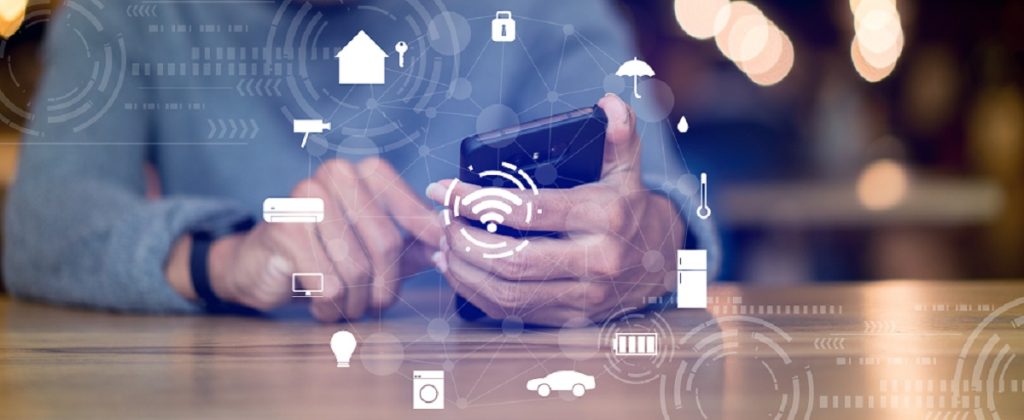 man holds a cell phone which can access automated services